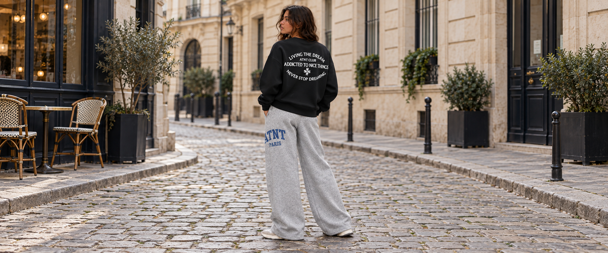 Sweat col rond Noir Never Stop Dreaming porté dans une ambiance lifestyle ATNT PARIS