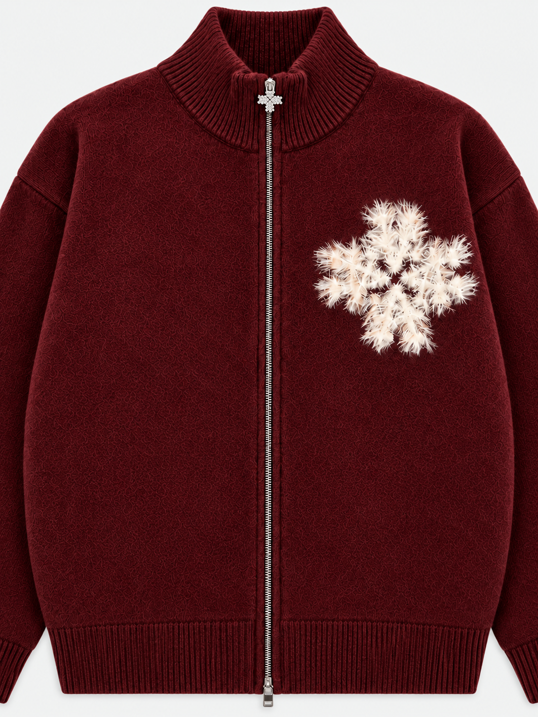 ATNT Tracksuits studio : Sweat zippé en maille fluffy monogramme signature bordeaux, détail de la matière sur fond gris clair